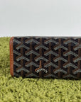 Pochette Goyard Jouvence in tela Goyardine nera con profili marroni