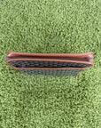 Pochette Goyard Jouvence in tela Goyardine nera con profili marroni