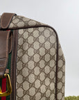 Valigia vintage Gucci realizzata in tela GG monogramma con dettagli in pelle marrone e strisce Web