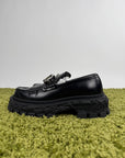 Louis Vuitton Mocassini Baroque in pelle nera 43 veste 44