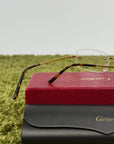 Occhiali Cartier con montatura dorata