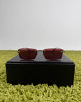 Occhiali Gucci con montatura a giorno e Lente Rossa