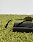 Occhiali da sole Panthère de Cartier CT0433S montatura Rimless e dettagli a testa di pantera sulle asse oro