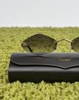 Occhiali da sole Panthère de Cartier CT0433S montatura Rimless e dettagli a testa di pantera sulle asse oro