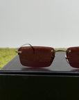Occhiali Gucci con montatura a giorno e Lente Rossa
