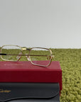 Occhiali Cartier Con aste oro e nere
