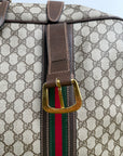 Valigia vintage Gucci realizzata in tela GG monogramma con dettagli in pelle marrone e strisce Web