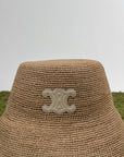 Cappello celine alla pescatora Triomphe in rafia beige
