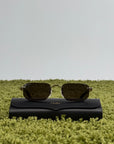 Occhiali da sole Cartier CT0622S con aste in acetato nero con un dettaglio dorato a forma di C