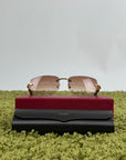 Occhiali da sole Cartier Signature C in metallo dorato con aste in legno