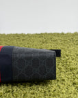Pochette Gucci nera blu e rossa
