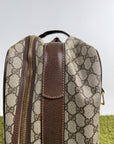Valigia vintage Gucci realizzata in tela GG monogramma con dettagli in pelle marrone e strisce Web