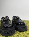 Louis Vuitton Mocassini Baroque in pelle nera 43 veste 44