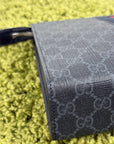 Pochette Gucci nera blu e rossa