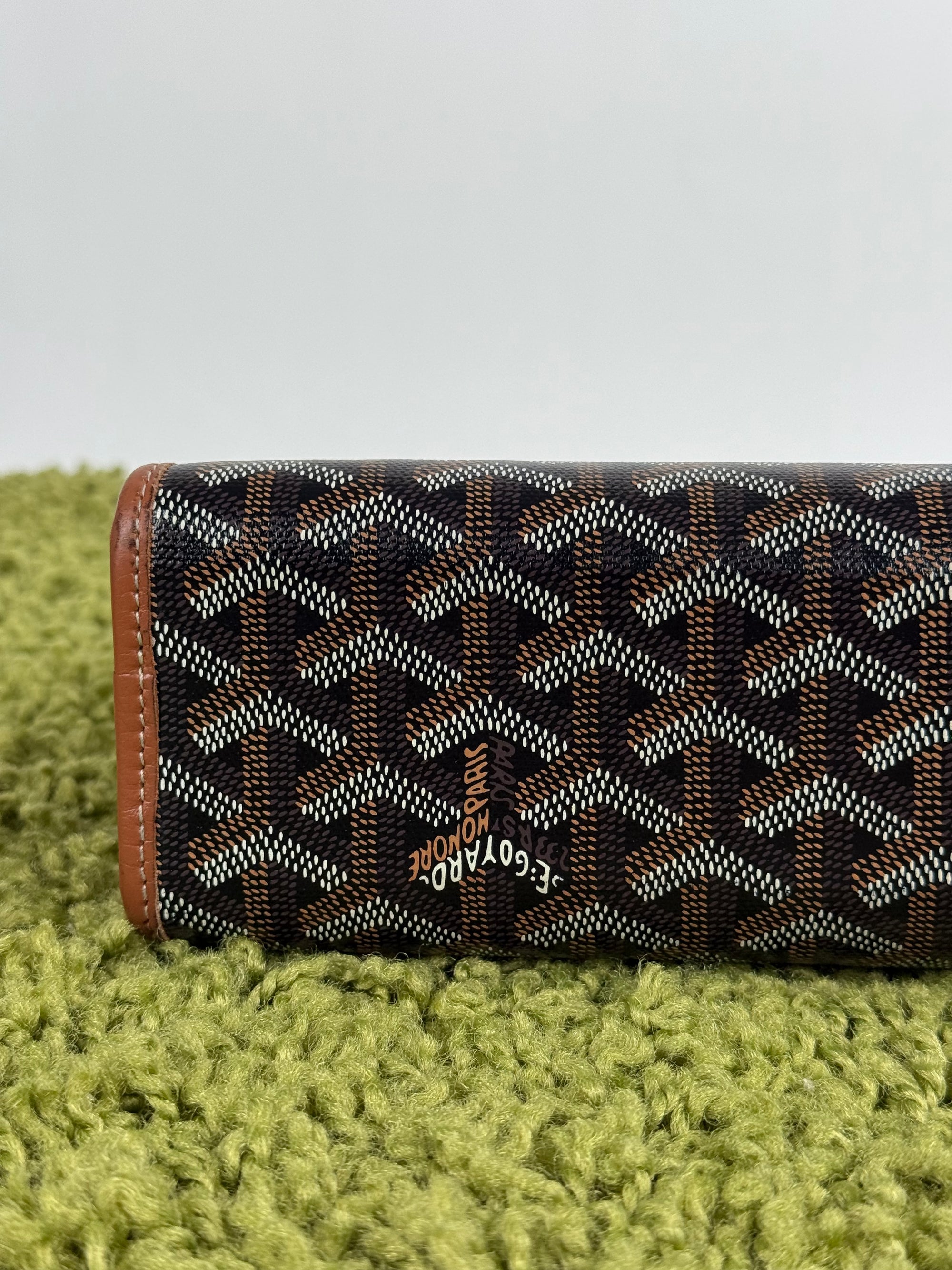 Pochette Goyard Jouvence in tela Goyardine nera con profili marroni