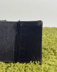 Borsa Balenciaga Hourglass Small in denim patchwork nero con logo B metallico argento