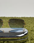 Occhiali da sole Rimless Cartier Eyewear Oro con lenti sfumate
