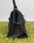Borsa Balenciaga Hourglass Small in denim patchwork nero con logo B metallico argento