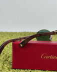Cartier Eyewear Con montatura ovale e aste in legno