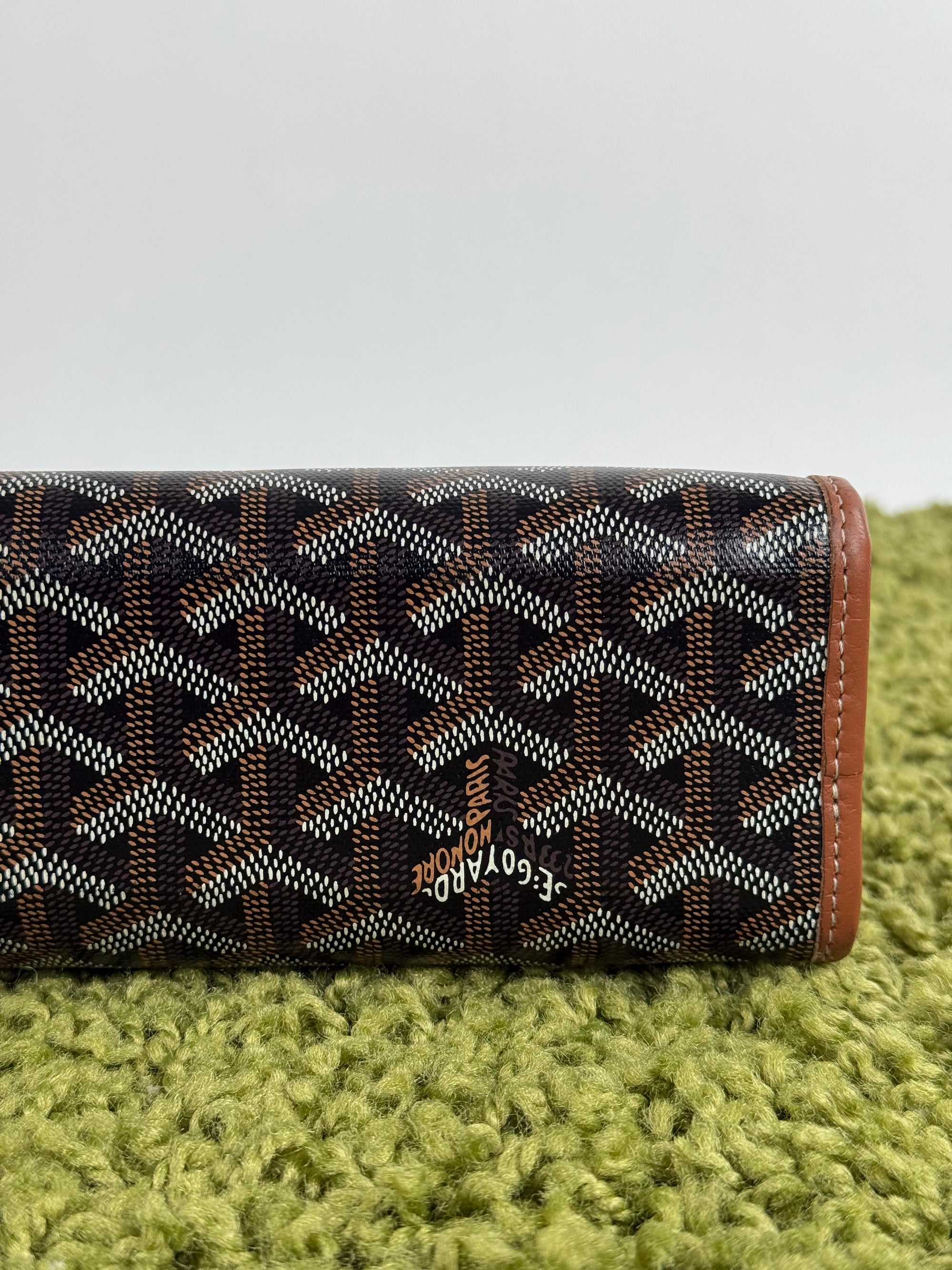 Pochette Goyard Jouvence in tela Goyardine nera con profili marroni