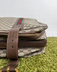 Valigia vintage Gucci realizzata in tela GG monogramma con dettagli in pelle marrone e strisce Web