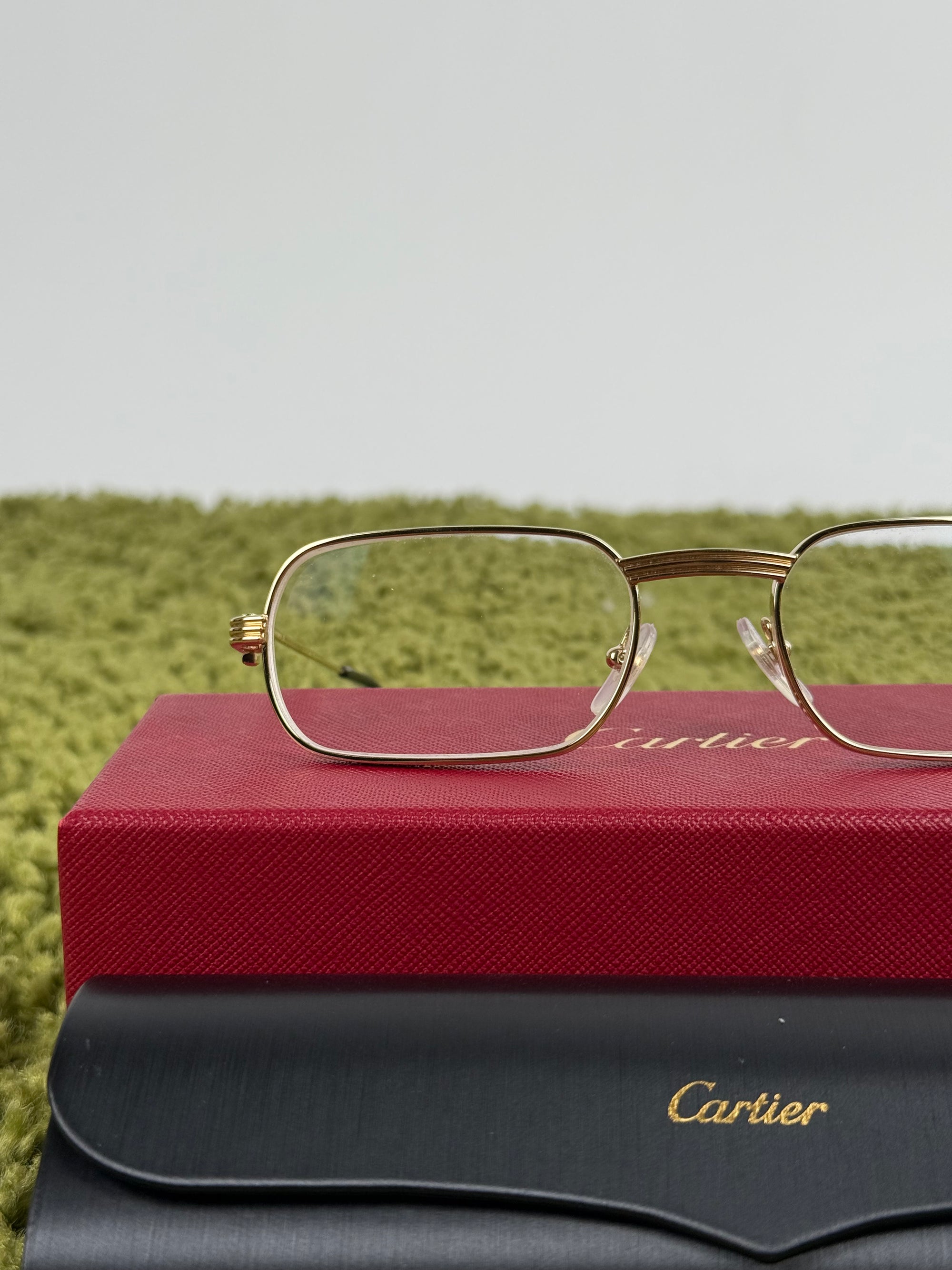 Occhiali Cartier Con aste oro e nere
