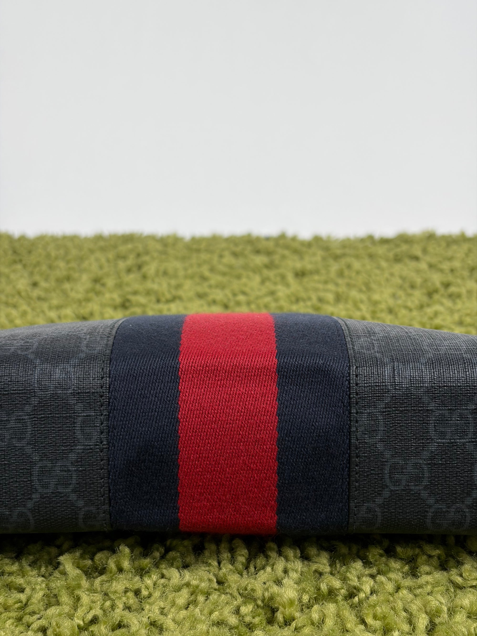 Pochette Gucci nera blu e rossa