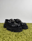 Louis Vuitton Mocassini Baroque in pelle nera 43 veste 44