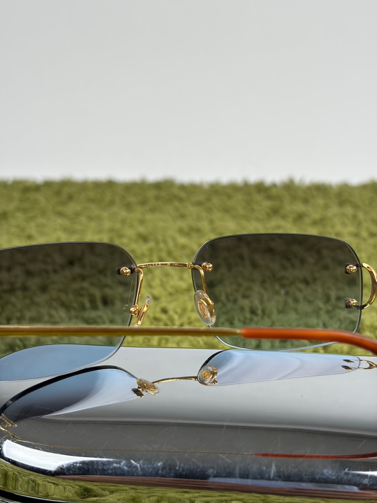 Occhiali da sole Rimless Cartier Eyewear Oro con lenti sfumate