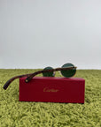 Cartier Eyewear Con montatura ovale e aste in legno