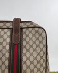 Valigia vintage Gucci realizzata in tela GG monogramma con dettagli in pelle marrone e strisce Web