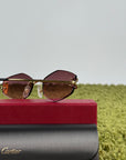 Occhiali da sole Geometrici Panthère de Cartier con lenti rosa e aste oro