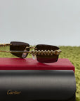 Occhiali Cartier CT0544S con motivo a borchie Clash Sulle aste oro