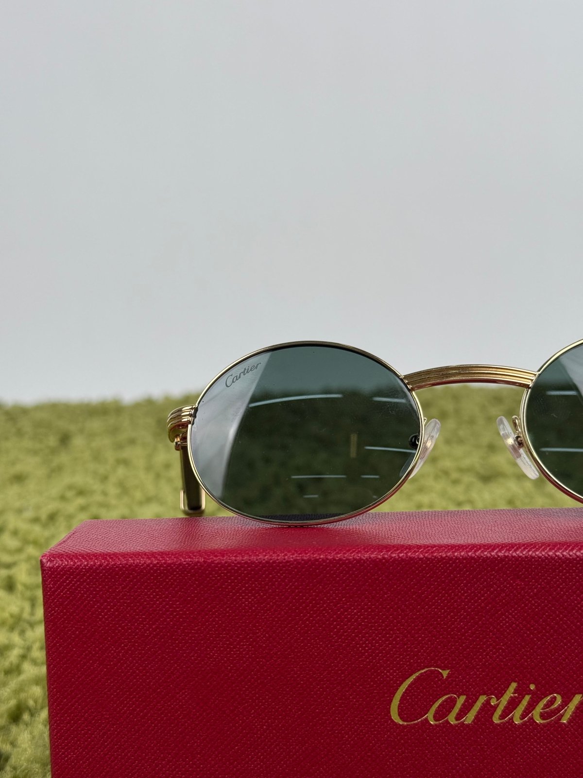 Cartier Eyewear Con montatura ovale e aste in legno - Second Hand Di Fiore