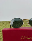 Cartier Eyewear Con montatura ovale e aste in legno