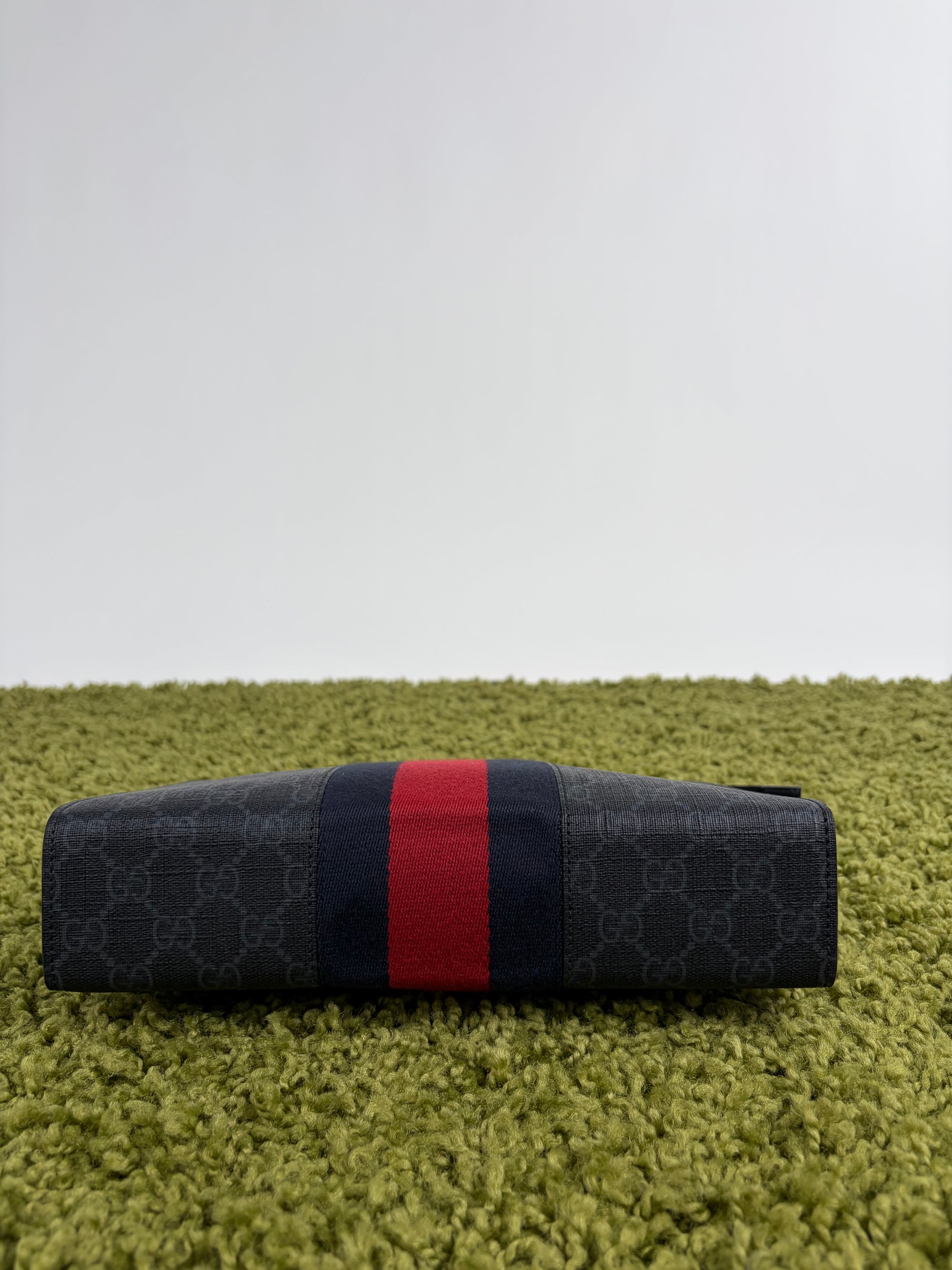 Pochette Gucci nera blu e rossa