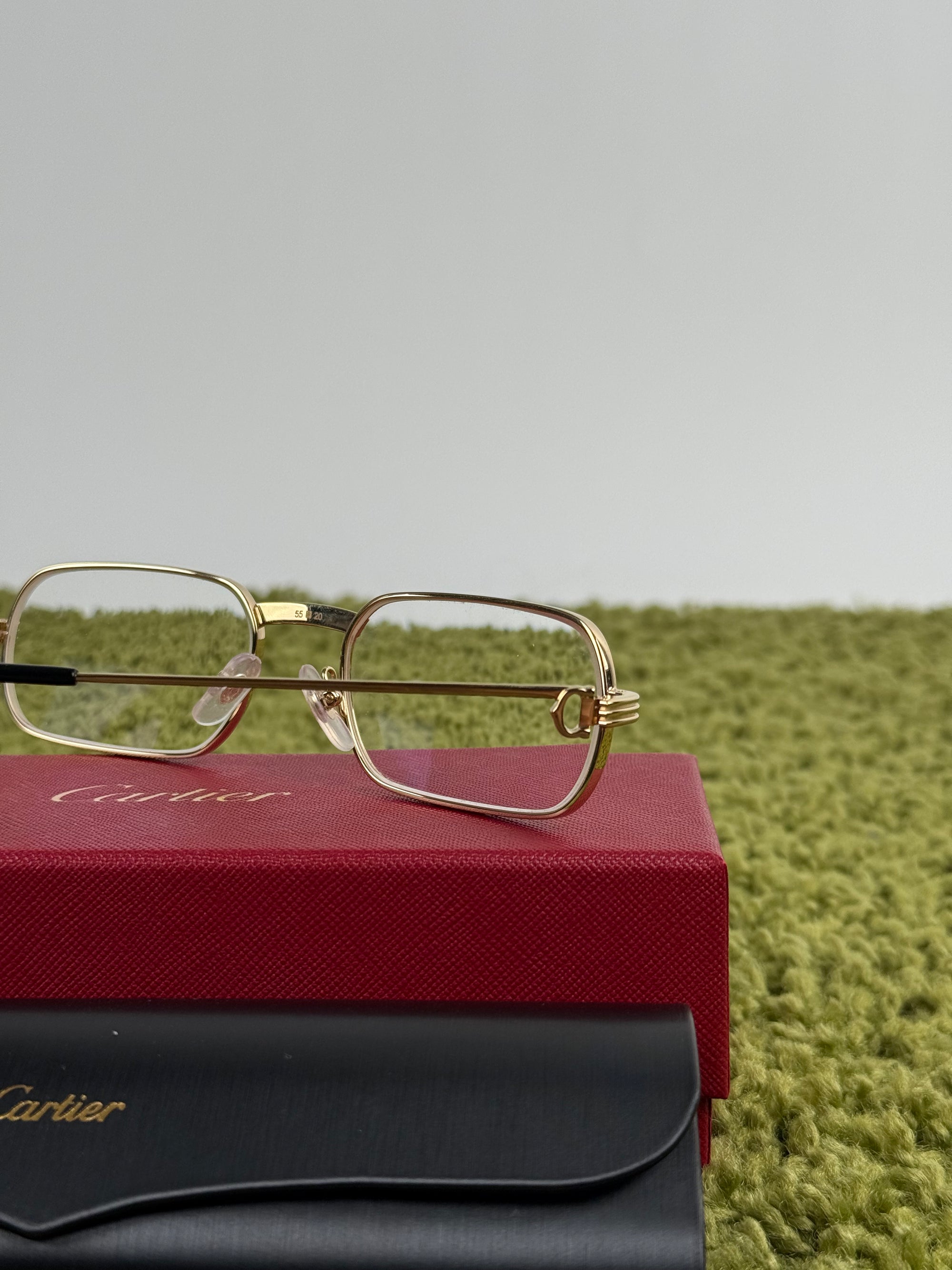 Occhiali Cartier Con aste oro e nere