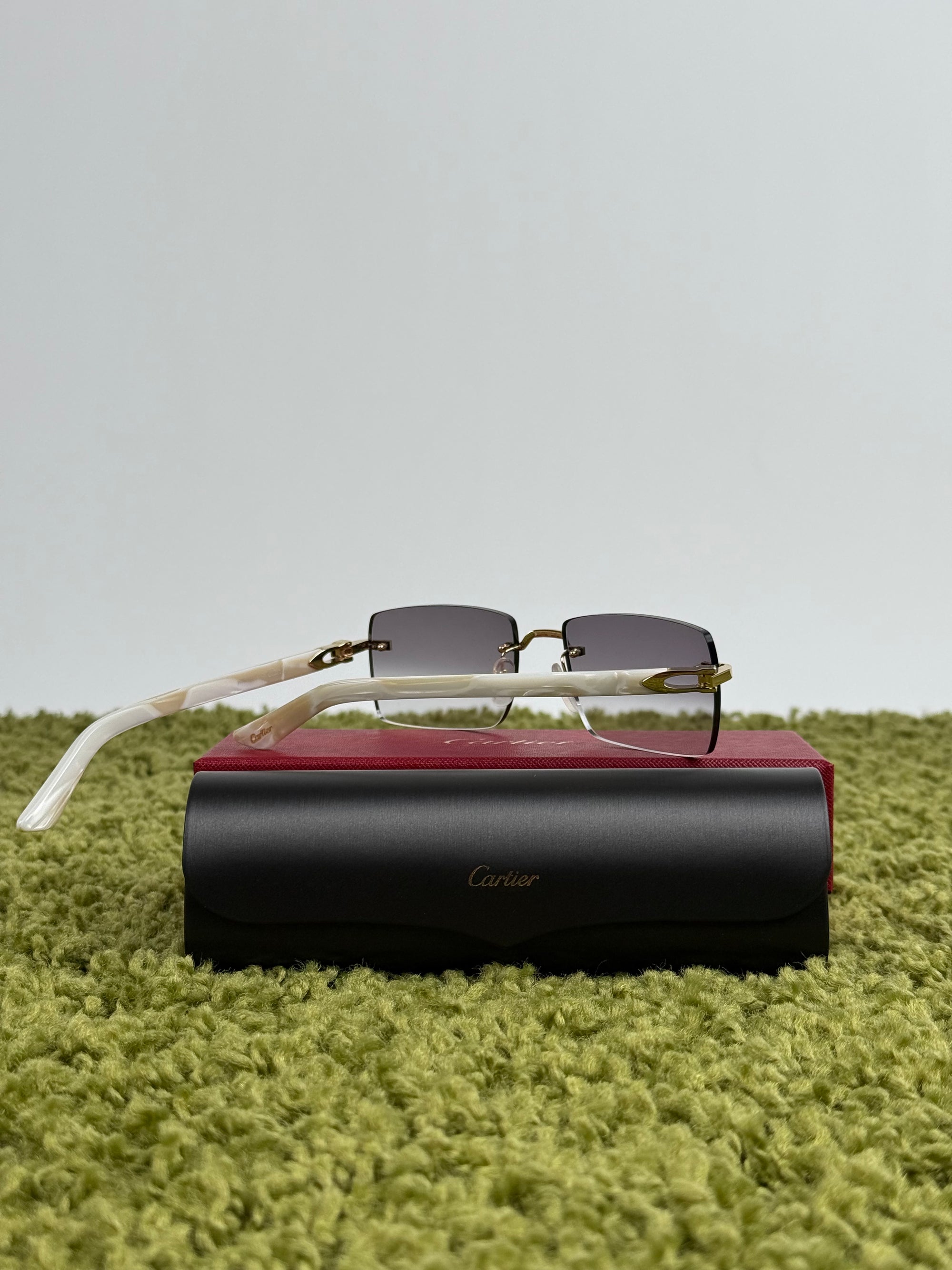 Occhiali Cartier CT0058O con aste in acetato effetto avorio