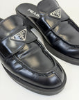 Mocassini Prada in pelle con placca