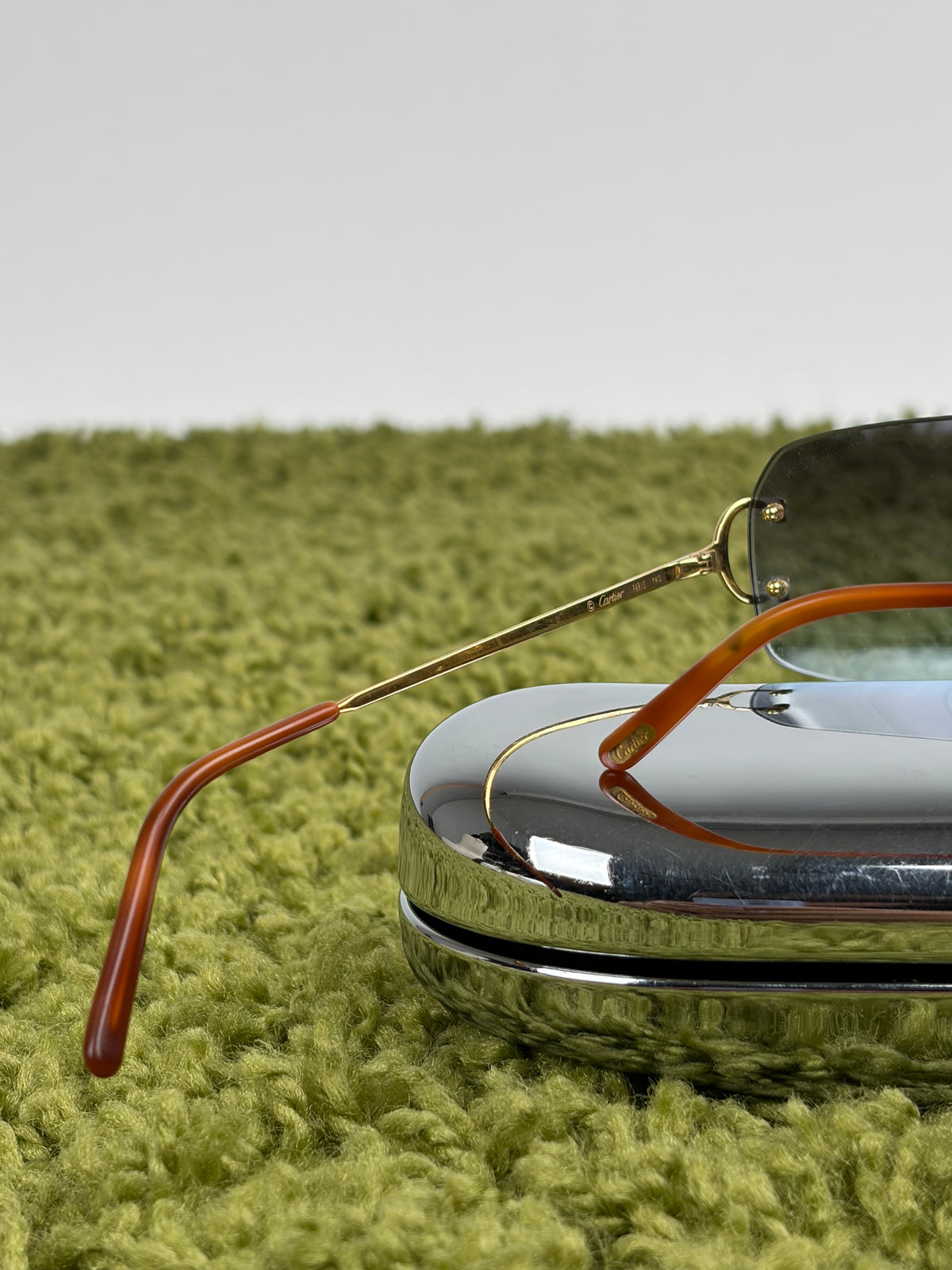 Occhiali da sole Rimless Cartier Eyewear Oro con lenti sfumate