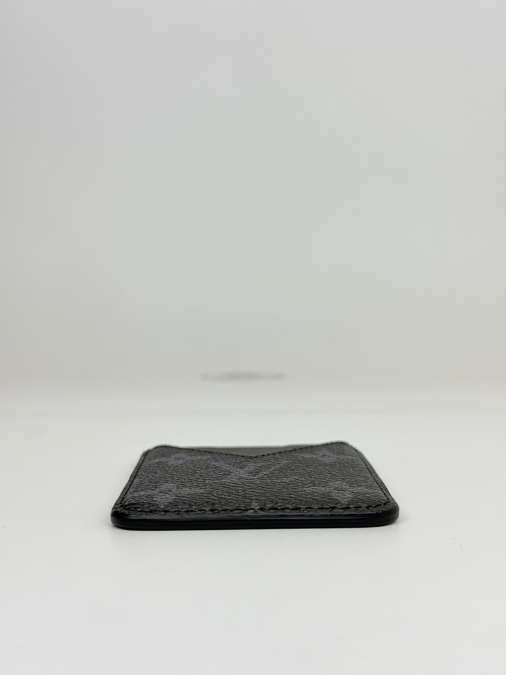 Portacarte magnetico Eclipse nero e grigio