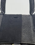 Borsa Balenciaga Hourglass Small in denim patchwork nero con logo B metallico argento