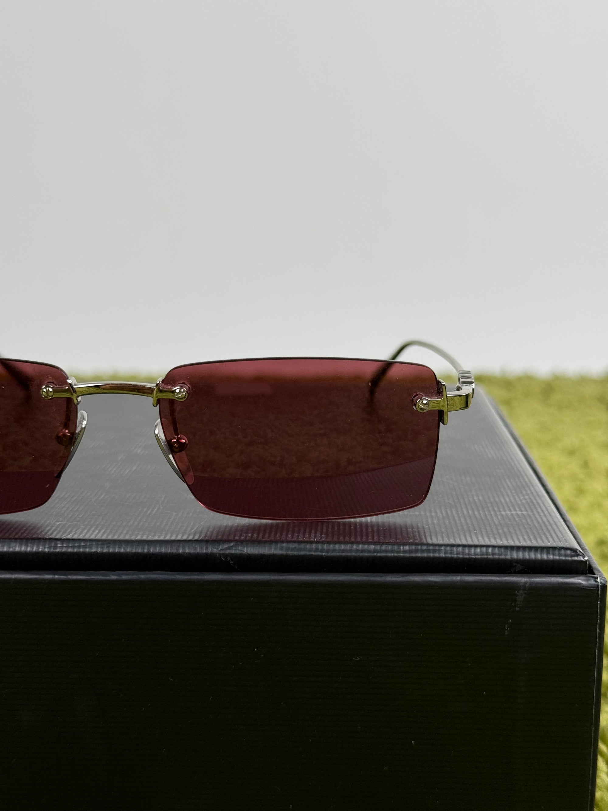 Occhiali Gucci con montatura a giorno e Lente Rossa