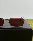 Occhiali Gucci con montatura a giorno e Lente Rossa