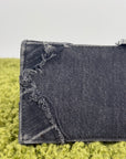 Borsa Balenciaga Hourglass Small in denim patchwork nero con logo B metallico argento