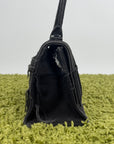 Borsa Balenciaga Hourglass Small in denim patchwork nero con logo B metallico argento