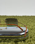 Occhiali da sole Rimless Cartier Eyewear Oro con lenti sfumate