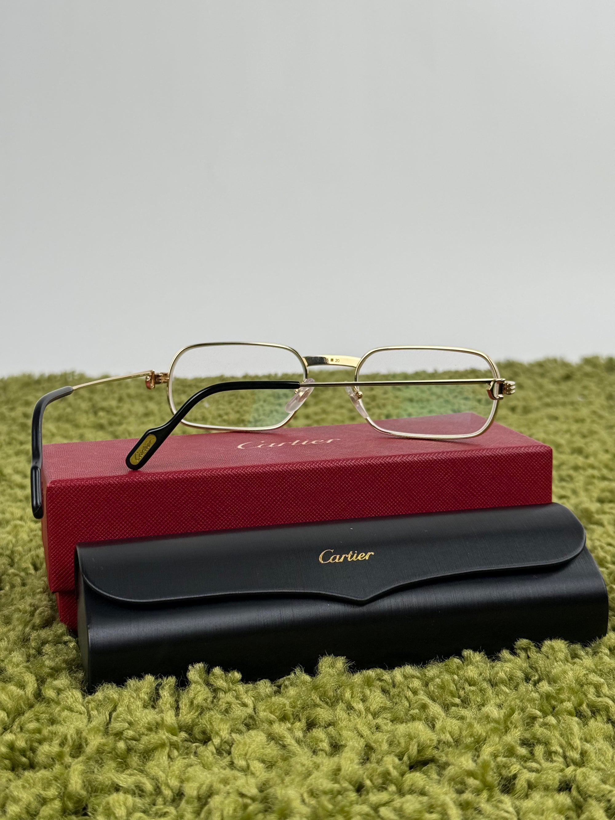 Occhiali Cartier Con aste oro e nere