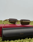 Occhiali Cartier CT0544S con motivo a borchie Clash Sulle aste oro