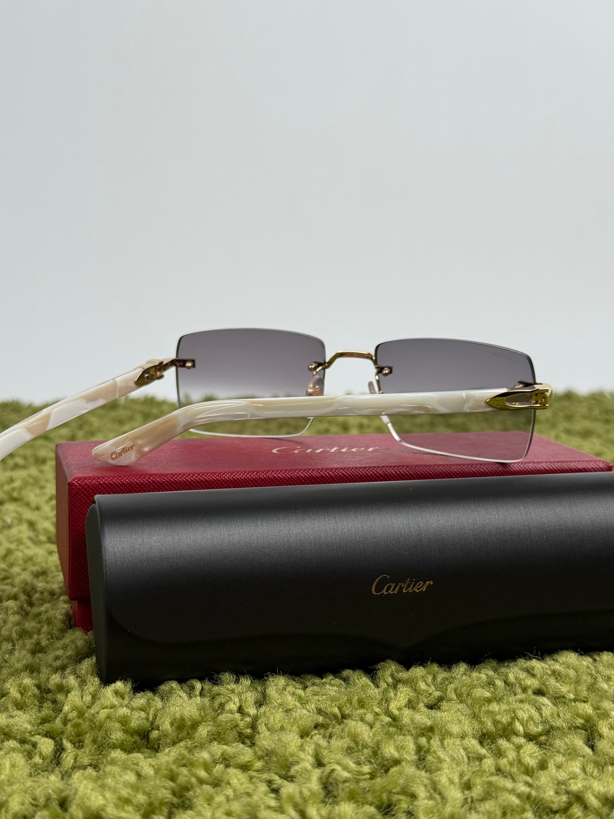 Occhiali Cartier CT0058O con aste in acetato effetto avorio